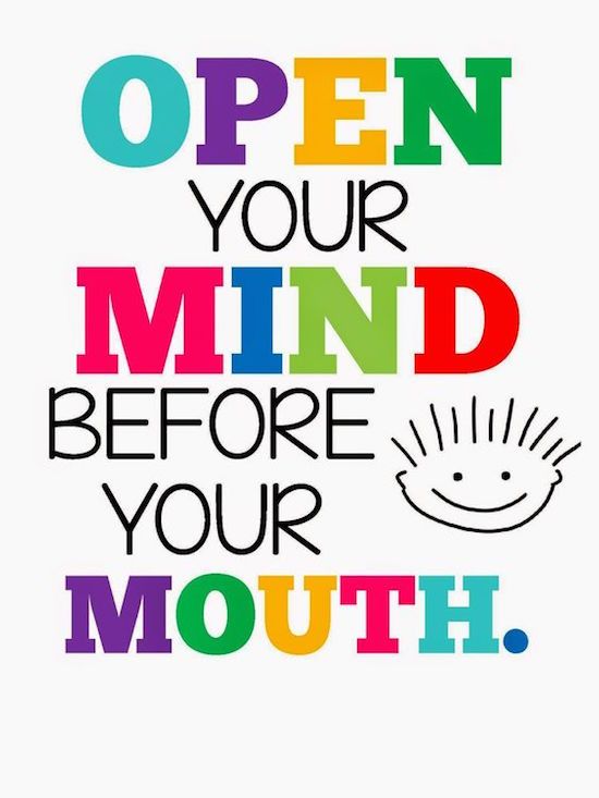 the words open your mind before your mouth are painted in rainbows and black on white