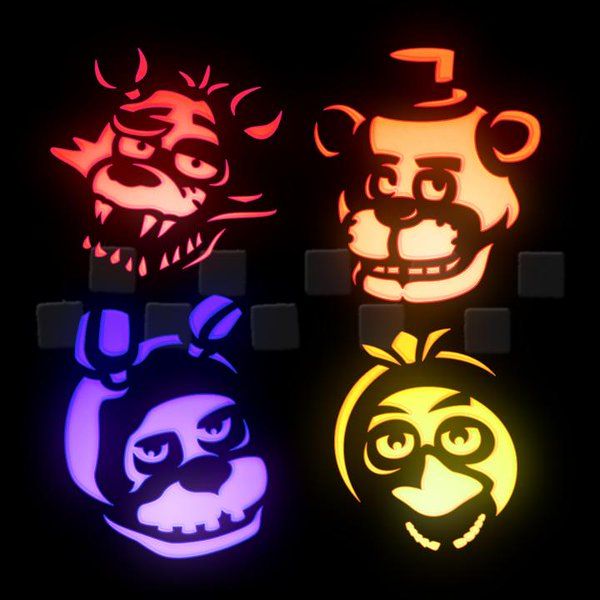 three different colored lights that have faces on them, one with an evil face and the other with a demon's head