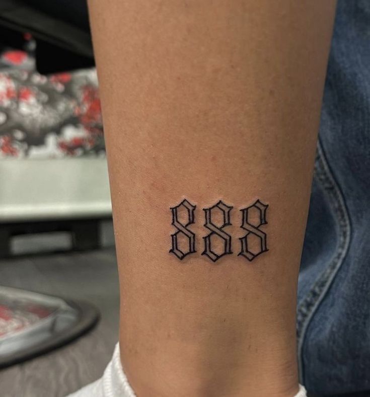 a tattoo on the leg of a woman with three hexagons tattooed on it