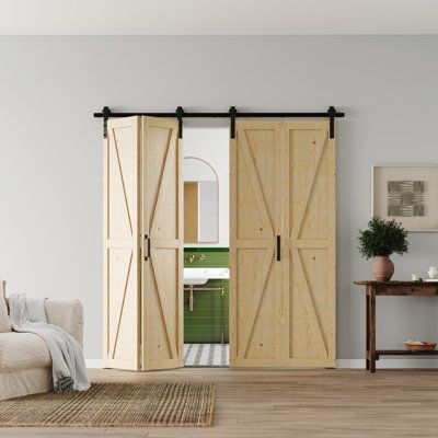 a living room filled with furniture and sliding doors