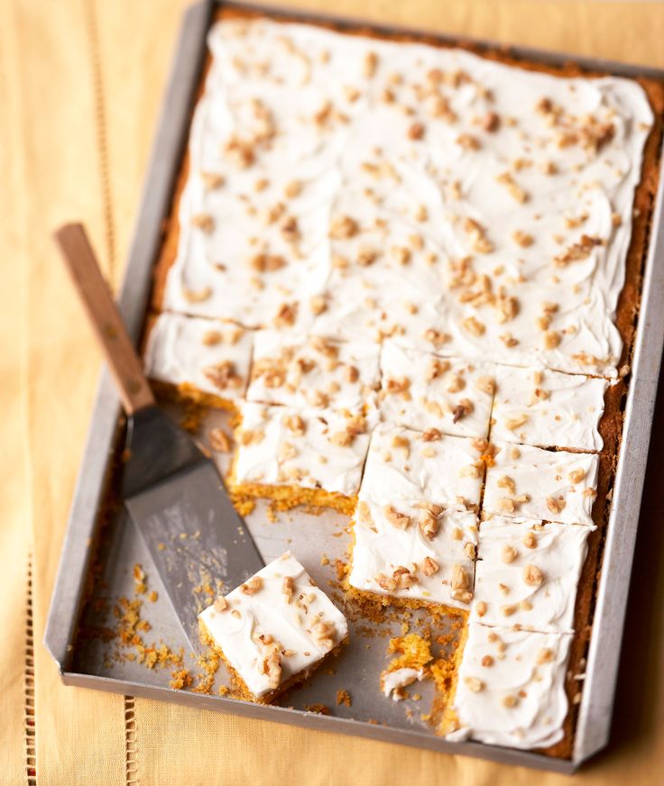 a pan filled with cake sitting on top of a wooden table