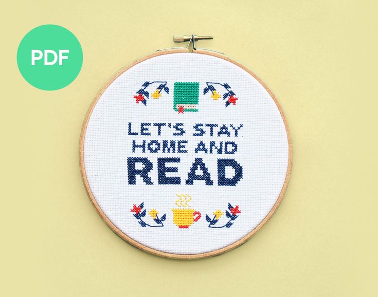 a cross stitch pattern with the words, let's stay home and read on it