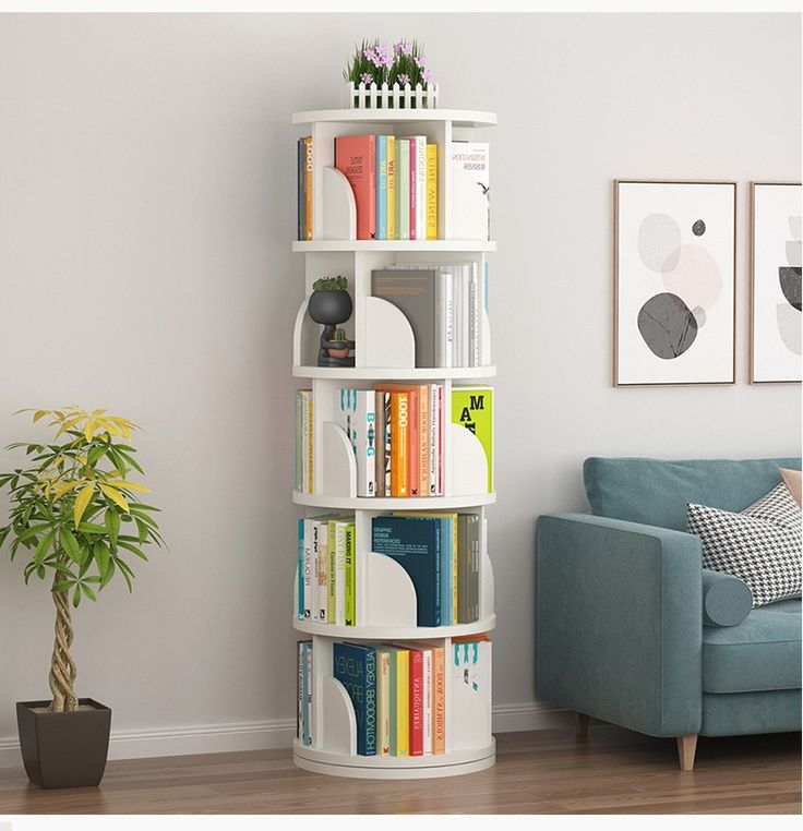 a living room filled with furniture and a tall book shelf next to a blue couch