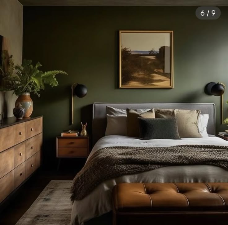 a bedroom with green walls and brown furniture