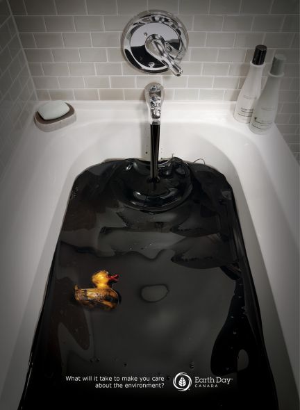 a white bath tub sitting under a faucet next to a wall mounted toilet