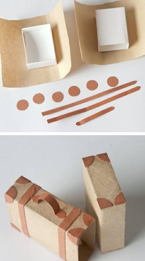 some cardboard boxes are sitting on the table and one is made out of brown paper