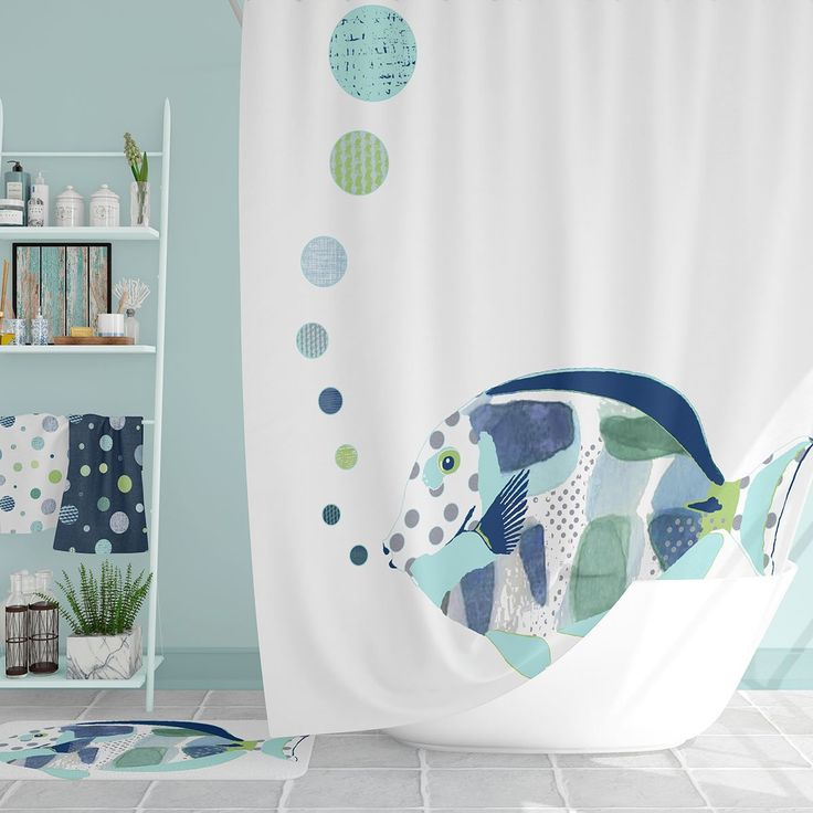 a shower curtain with fish on it in a blue and white bathroom, next to shelves