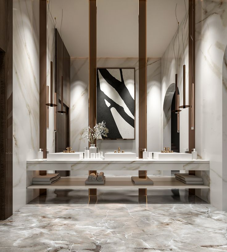 a bathroom with marble floors and two sinks