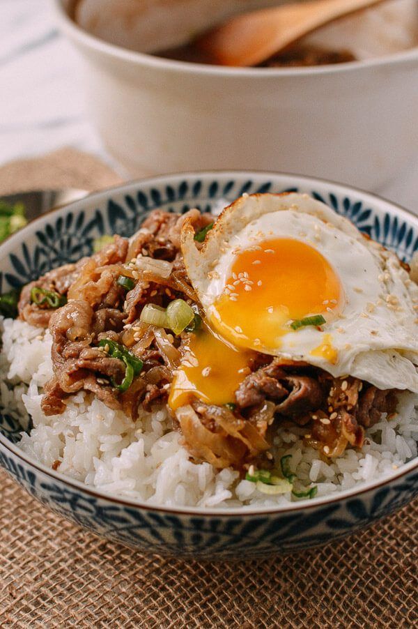 an egg is on top of rice in a bowl