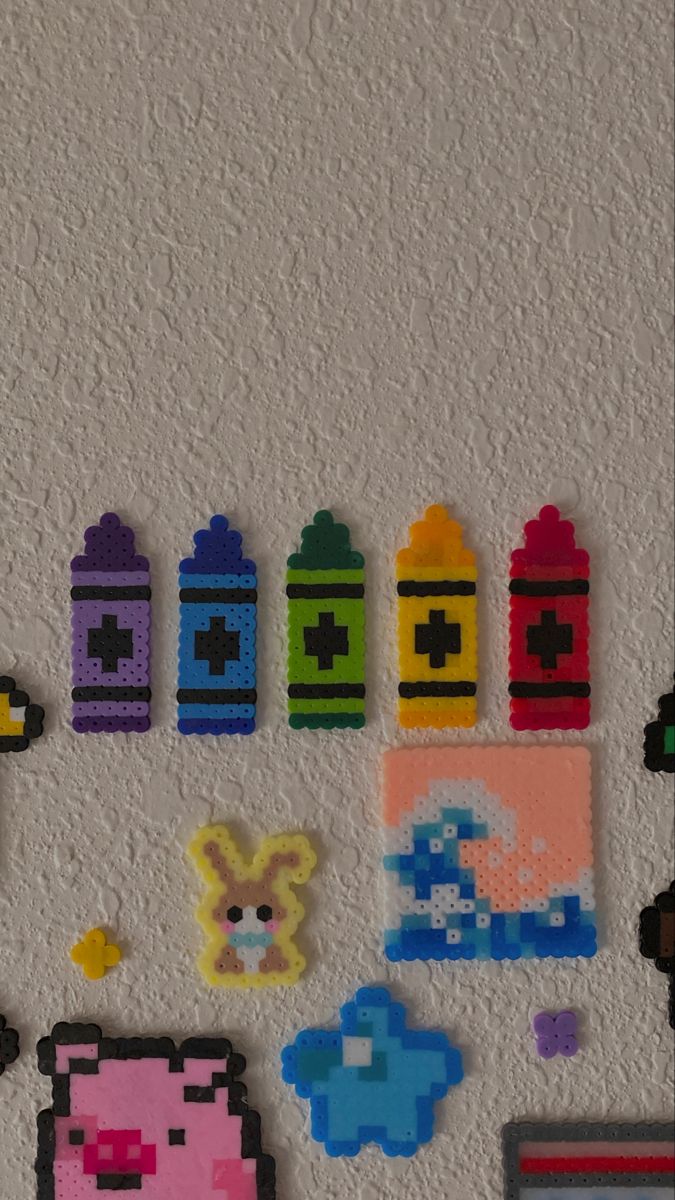 the wall is decorated with legos and magnets for kids to use on their crafts