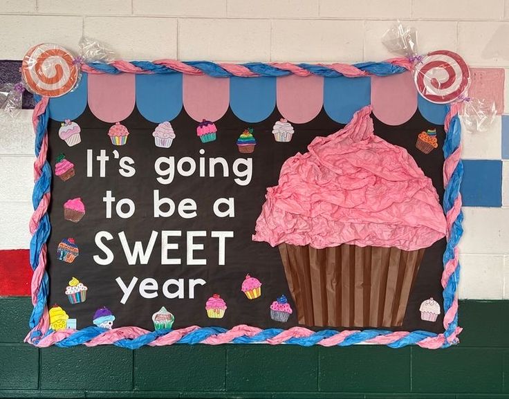 a sign that says it's going to be a sweet year with a cupcake