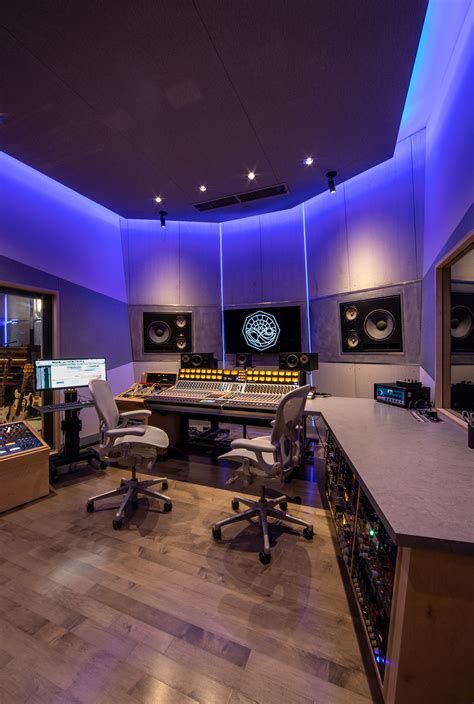 a recording studio with several monitors and sound equipment