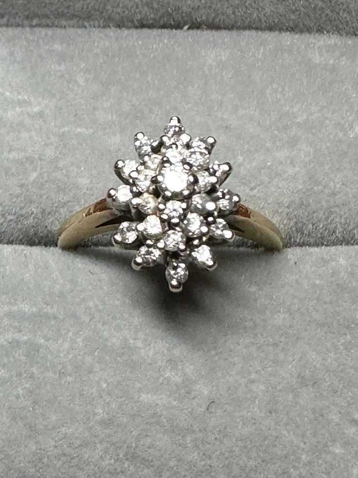 For your consideration, a 14K yellow gold CZ cluster ring.  It is hallmarked 14K and guaranteed to be such. It features graduated stones spanning the top to bottom. The top stone measure 2.5mm, mid-levels stones are 2mm stones and the bottom level are 1mm stones. The setting measures 14mm x 10mm.  It is a size 4 3/4 and weighs in at 3.8 grams.  Love sparkle?  Here's your ring! Luxury Silver Cluster Ring Collectible, Luxury Silver Dazzling Cluster Ring, Luxury Gold Vintage Cluster Ring, Luxury Vintage White Cluster Ring, Luxury Antique Hallmarked Cluster Ring, Luxury Exquisite Gold Cluster Ring, Service Merchandise Diamond Cluster Ring 1970s, 14k Gold Cluster Diamond Ring With Prong Setting, Yellow Gold Cluster Ring With Cubic Zirconia