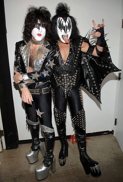 two people dressed up as kiss band members