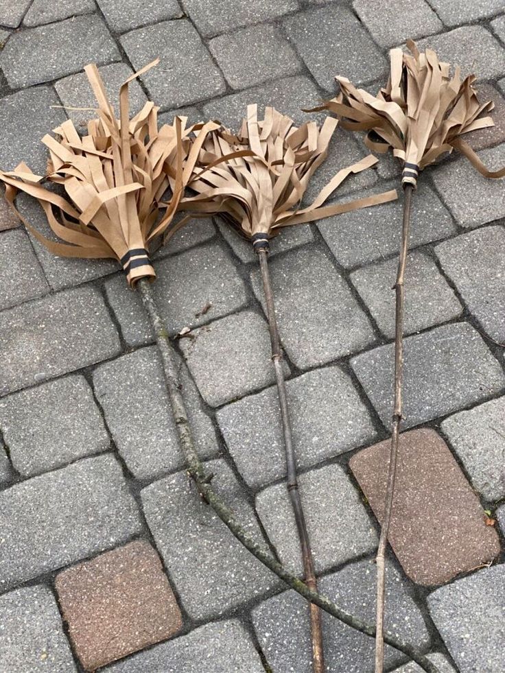 two umbrellas that have been placed on the ground with sticks sticking out of them