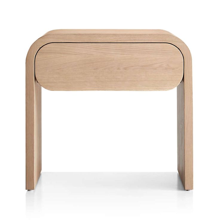 the side table is made from wood and has an open drawer on one end,