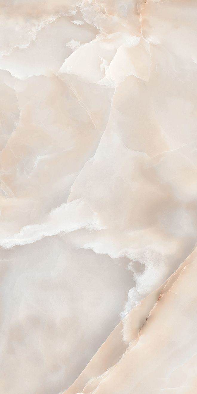 an aerial view of the top of a mountain with snow on it's sides