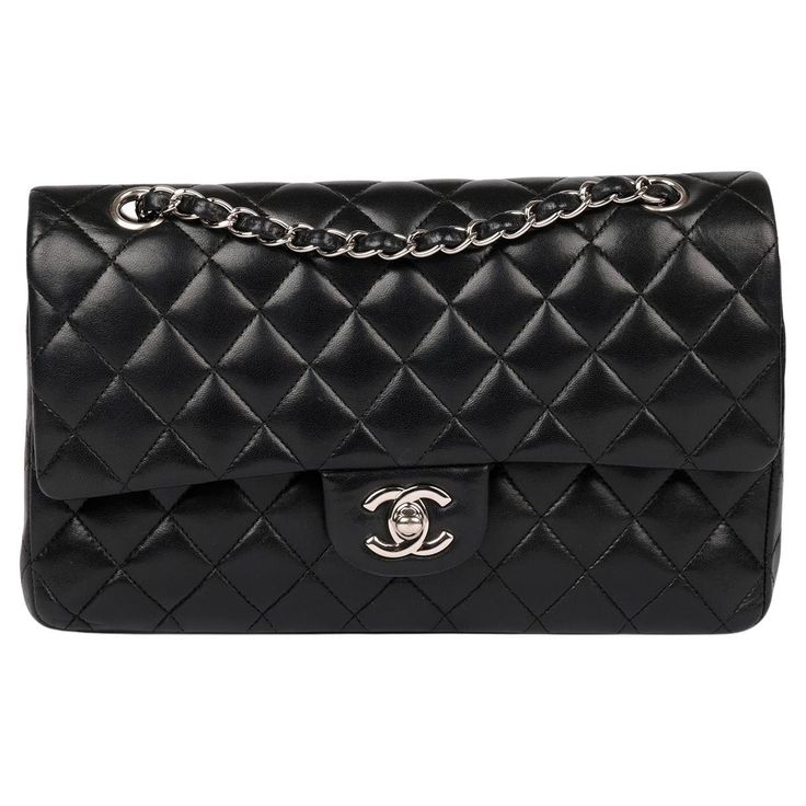 Chanel Black Quilted Lambskin Medium Classic Double Flap Bag Brand- Chanel Model- Medium Classic Double Flap Bag Product Type- Crossbody, Shoulder Serial Number- 10****** Age- Circa 2005 Accompanied By- Chanel Dust Bag, Box, Authenticity Card Colour- Black Hardware- Silver Material(s)- Lambskin Leather Authenticity Details- Serial Sticker, Authenticity Card Height- 15cm Width- 25cm Depth- 7cm Strap Drop- Single: 24cm Double: 43cm Interior- Burgundy Leather Closure- Turn Lock Country of Origin- F Classic Bags With Palladium Hardware And Double Flap, Classic Bag With Palladium Hardware And Double Flap, Designer Bags With Silver-tone Hardware And Double Flap, Luxury Double Flap Bag With Silver-tone Hardware, Luxury Bags With Silver-tone Hardware And Double Flap, Luxury Bag With Silver-tone Hardware And Double Flap, Double Flap Bags With Palladium Hardware, Classic Bags With Double Flap And Silver-tone Hardware, Chanel Model