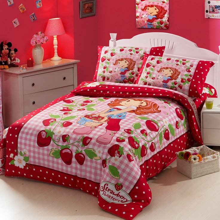 a bedroom with pink walls, white furniture and red polka dot bedspread on the bed