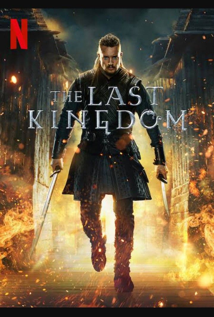 the last kingdom movie poster with a man in armor holding two swords and standing on fire