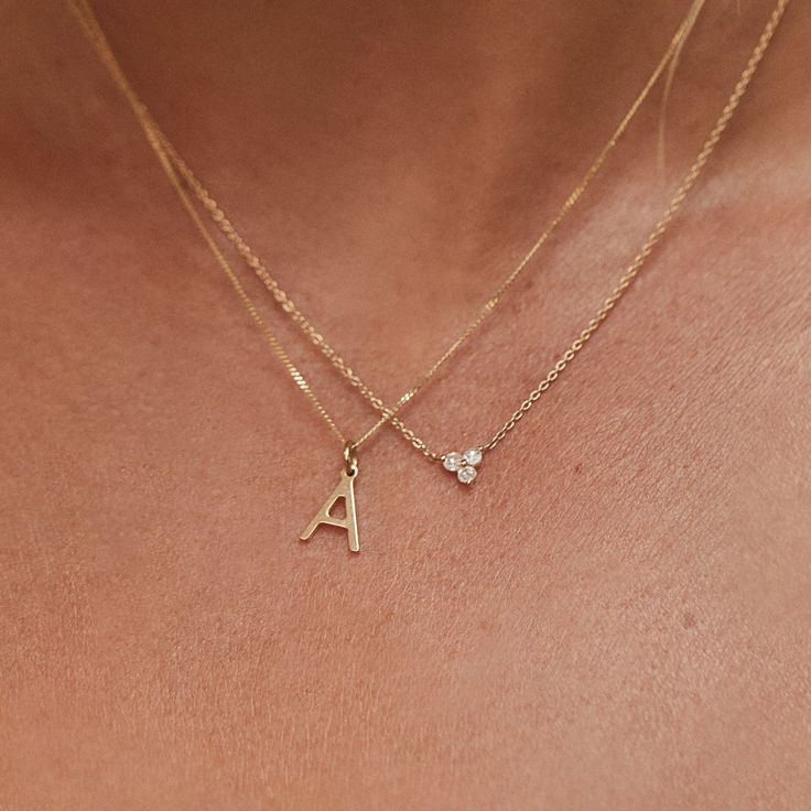 LILY & ROO's small initial letter Charm Necklace in solid 9ct gold is the perfect jewellery gift for her. Solid gold initial necklaces come with a matching chain and complement any outfit. All gold letter necklaces come in a LILY & ROO gift box as standard. Give your jewellery a little TLC to keep your jewellery shining bright. Your beautiful Initial charm necklace will be sent to you in a complimentary Lily & Roo gift box with ribbon tied in a beautiful bow. Necklace With A Letter, Initial Charm Necklace, Necklace Letter Initials, 14k Gold Initial Pendant Necklace, Fine Jewelry Initial Pendant Necklace For Anniversary, Anniversary Diamond Initial Pendant Necklace, Dainty Yellow Gold Initial Pendant Necklace, White Gold 14k Initial Pendant Necklace, 14k White Gold Initial Pendant Necklace