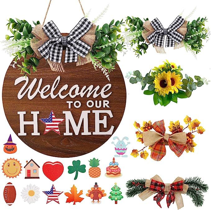 a wooden sign with the words welcome to our home surrounded by decorations and wreaths