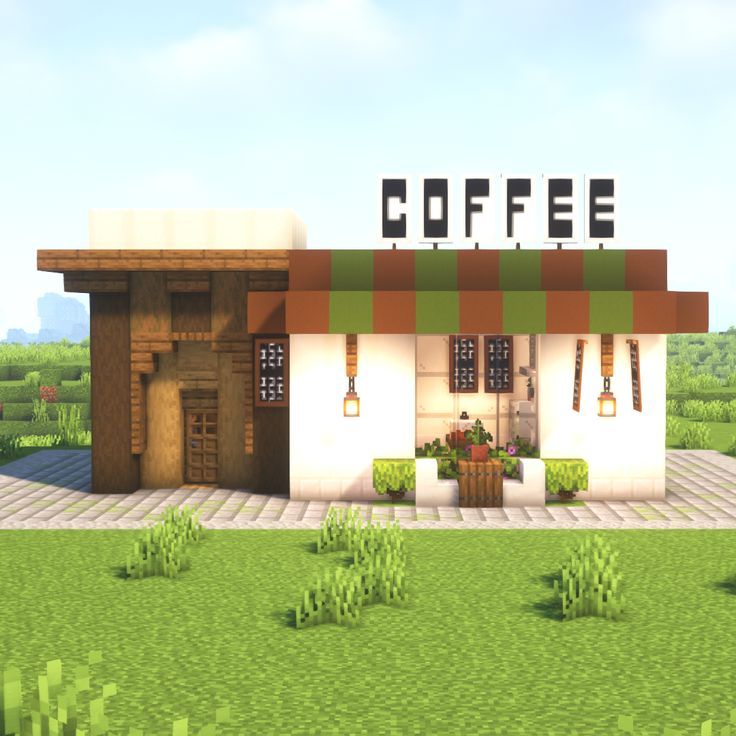 a small coffee shop sitting in the middle of a field