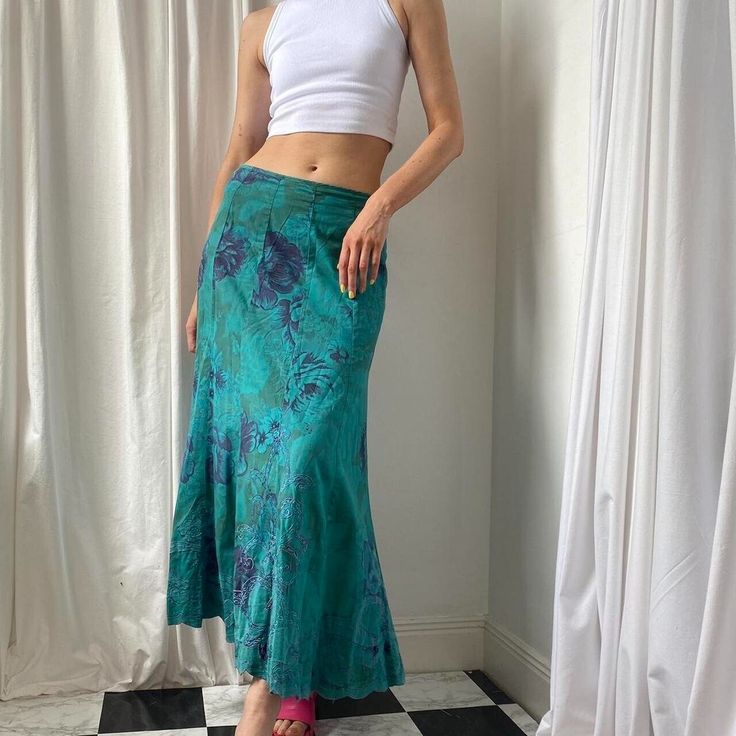 Beautiful Vintage 00s/Y2K boho teal blue bias cut long maxi skirt. 100% cotton Turquoise/teal blue floaty summer maxi skirt in a rose print floral pattern. Scalloped embroidered hemline. Could be worn low or mid waist. Lots of movement and volume. Zip fastening. Cotton lining. Size 12 on the label but seen on a size UK 8/10 5ft9" (worn low waist). Great condition. Brand: 2000s Per Una.  Measurements Waist: 32 inches Length: 36 inches Colourful Maxi Skirt, Fitted Green Cotton Maxi Skirt, Bohemian Fitted Maxi Skirt, Blue Bohemian Maxi Length Bottoms, Green Bohemian Maxi Bottoms, Bohemian Blue Maxi Length Bottoms, Bohemian Blue Maxi Bottoms, Fitted Green Hippie Skirt, Fitted Full-length Maxi Skirt For Festivals