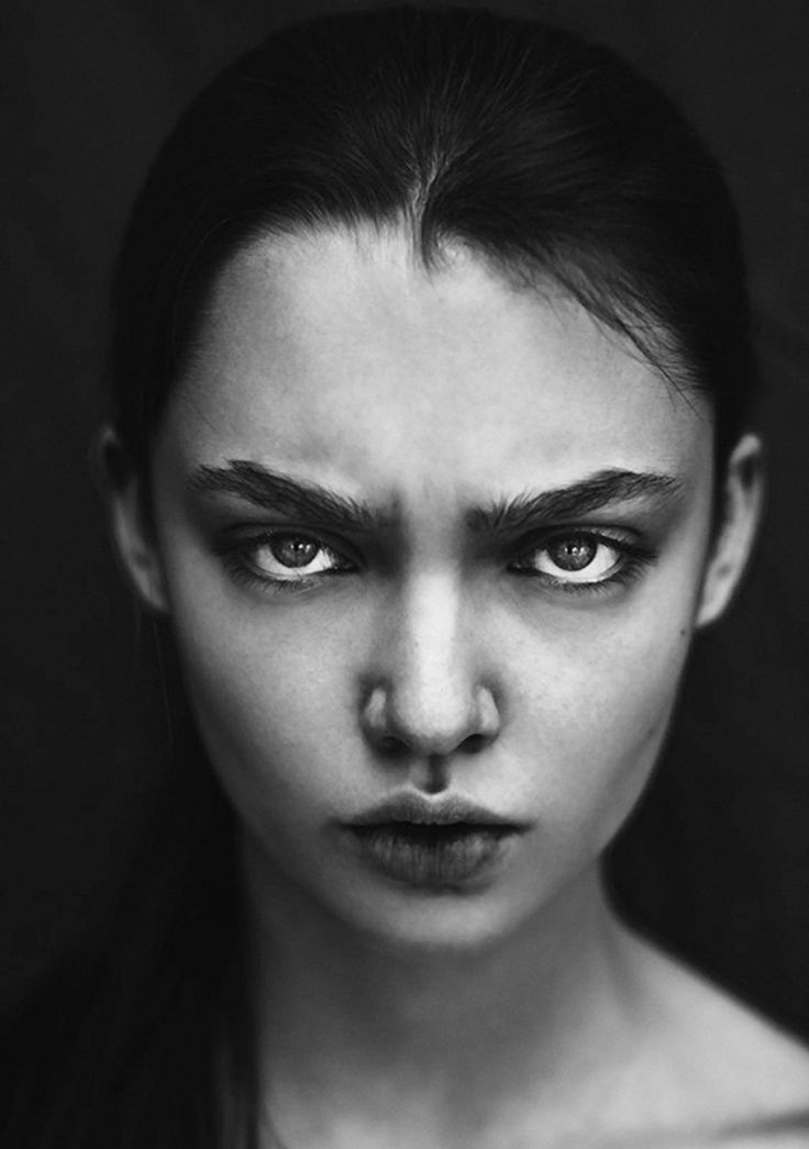 a black and white photo of a woman's face