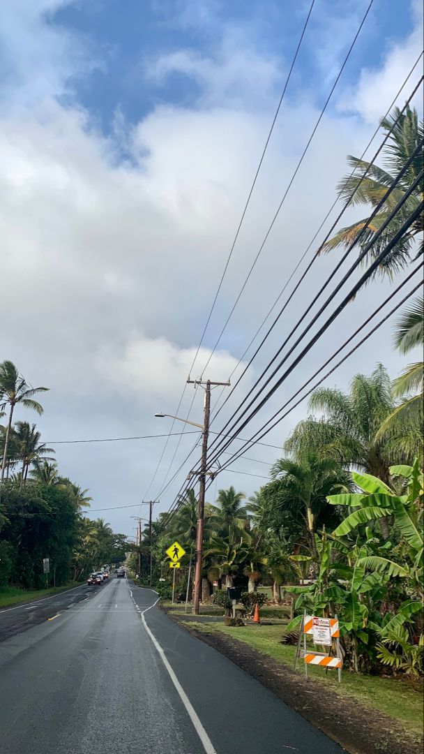 post rain on the streets in oahu hawaii with green lush tropical plants on the side of the road Hawaiian Neighborhoods, Hawaii Neighborhood, Hawaii Rain, North Shore Oahu Aesthetic, Oahu Aesthetic, Living In Hawaii, Oahu Hawaii Aesthetic, Pahoa Hawaii, Beach Town Aesthetic