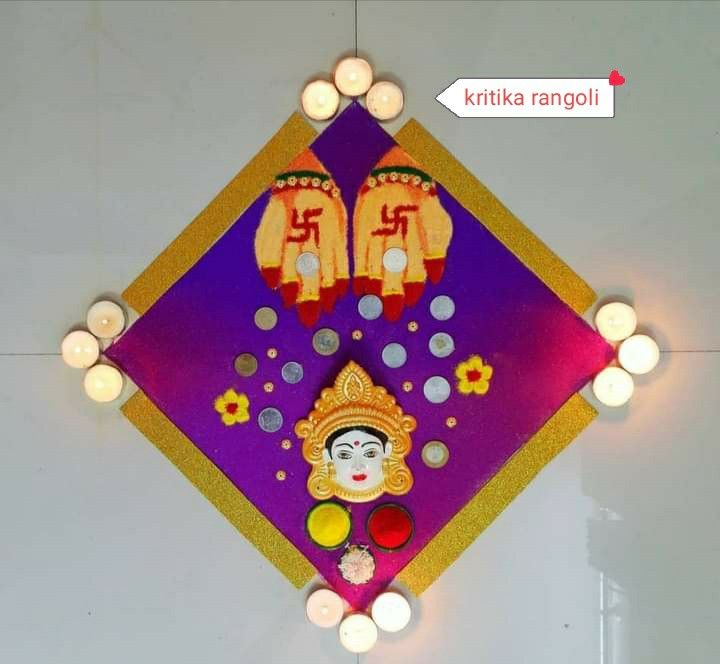 a decorative wall hanging with candles and lights on it's sides, depicting the face of a god