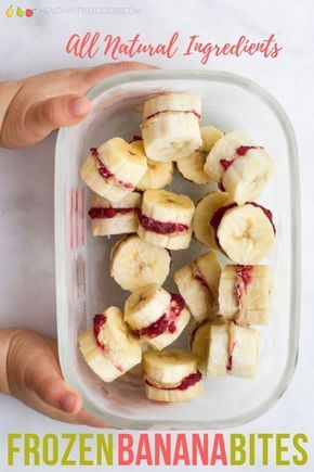 a person holding a bowl with sliced bananas and raspberry filling on it, in front of the words frozen banana bites