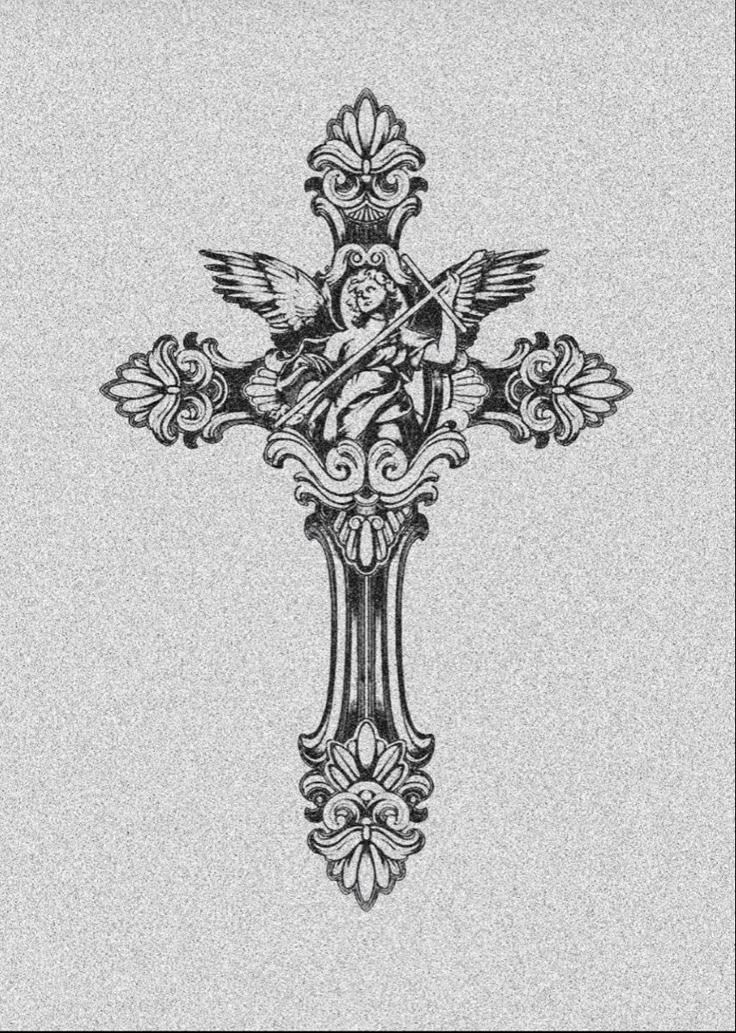 an ornate cross with a bird on it