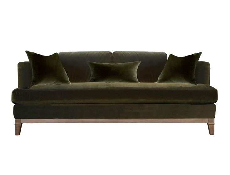 a green velvet couch with three pillows on it's back and two side ends