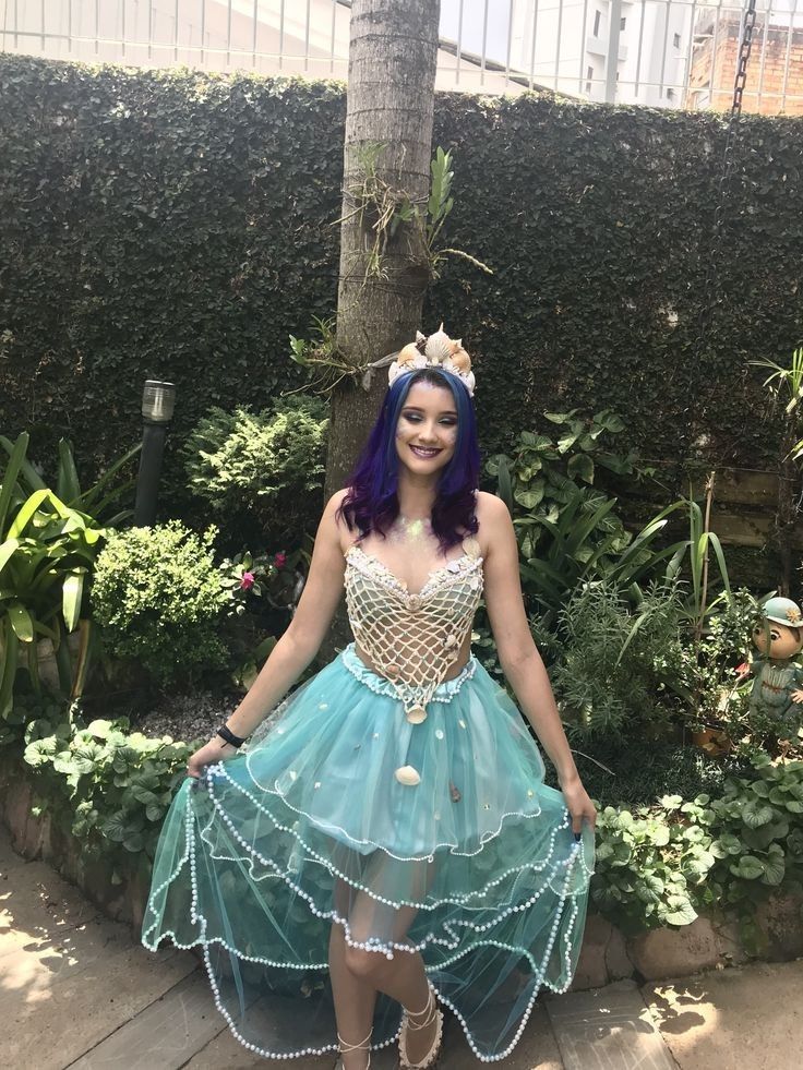 a woman in a costume standing on a wooden floor