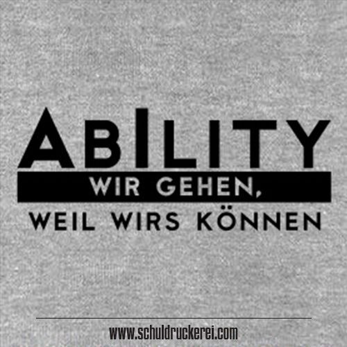 a grey shirt with the words ability written in black on it and an image of a man