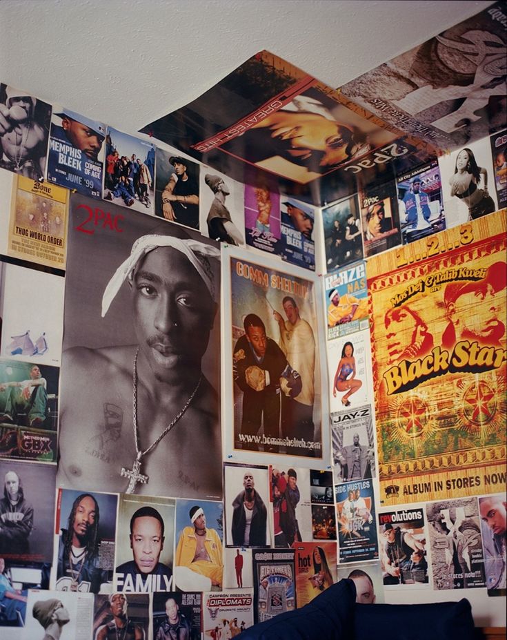 a room with many pictures on the wall