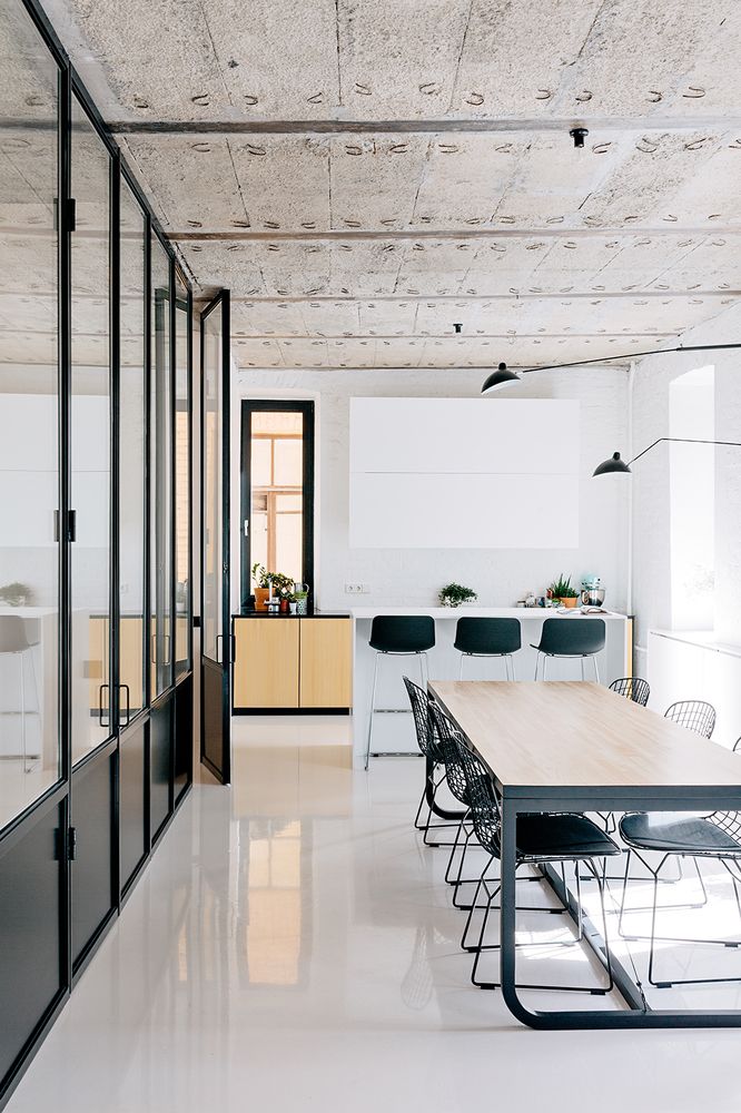 an empty room with tables and chairs in it