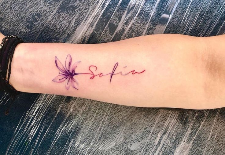 a woman's arm with a tattoo on it that says, sofia