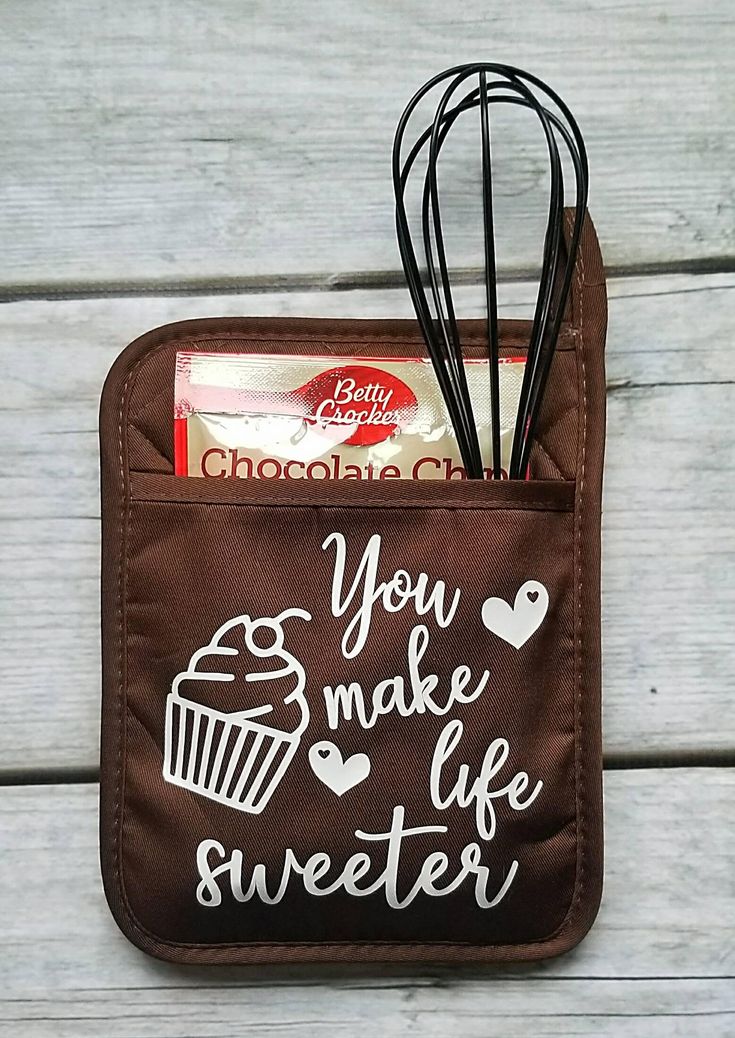 an oven mitt with utensils in it that says you make life sweeter