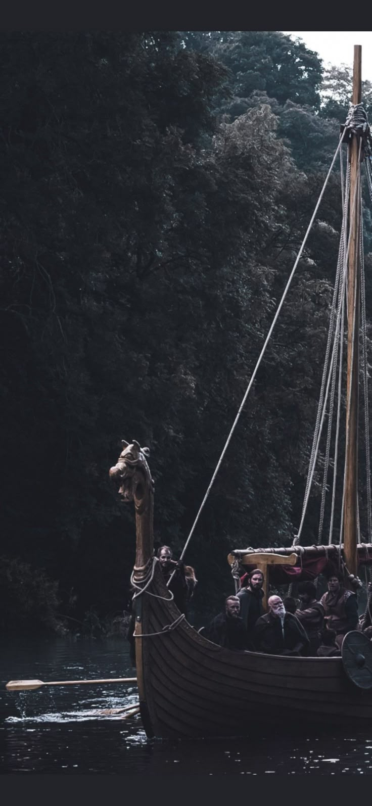 a boat with people on it in the water