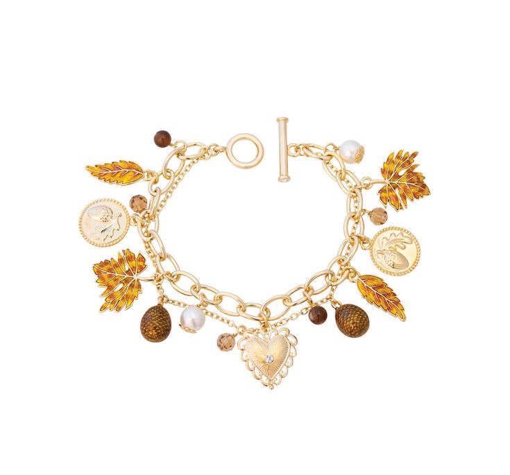 Fall Autumn Harvest Charm Bracelet.  This collectable charm bracelet is a fun addition to any outfit. Each charm is beautifully detailed and crafted; all being finished with a combination of hand applied enamel and hand set Swarovski crystals. All charms are fixed to a gold plated bracelet. Charms comprise; leaves, acorns and Swarovski pearls.     *    Gold plated and enamel Harvest charm bracelet     *    A collectable woman's charm bracelet to enjoy and wear year upon year     *    Dimensions: Gold Fall Jewelry, Fall Charm Bracelet, Halloween Jewlery, Charm Bracelet Gold, Crystal Falls, Autumn Necklace, Boo Basket, Book Jewelry, Bracelet Charms