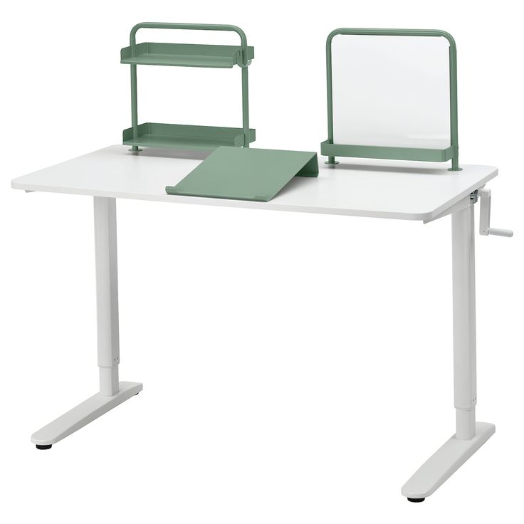 a computer desk with a laptop on it and a green chair next to the desk