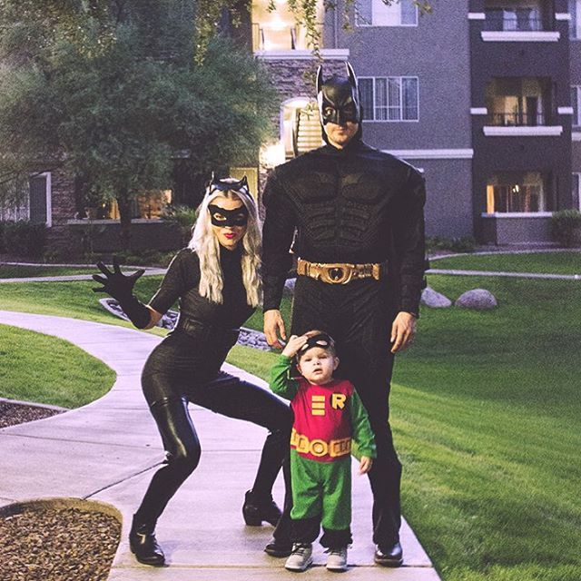 a family dressed up as batman and robin wayne