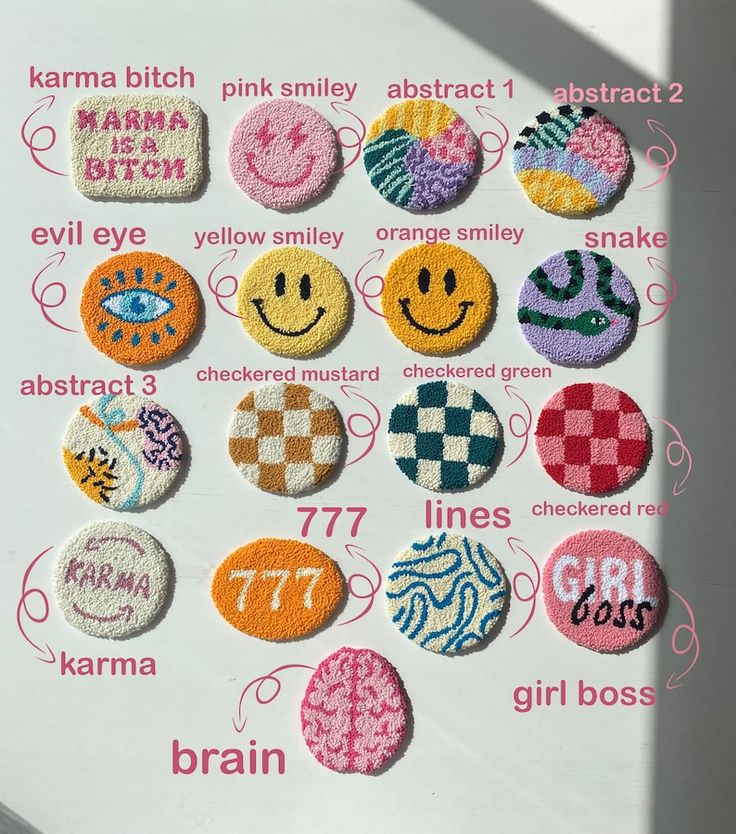 a bunch of different types of badges on a white surface with words written below them