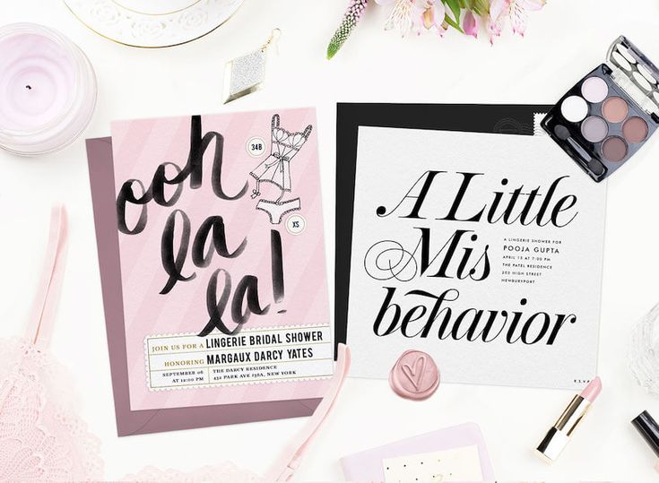 the wedding stationery is laid out on top of each other, including pink and black