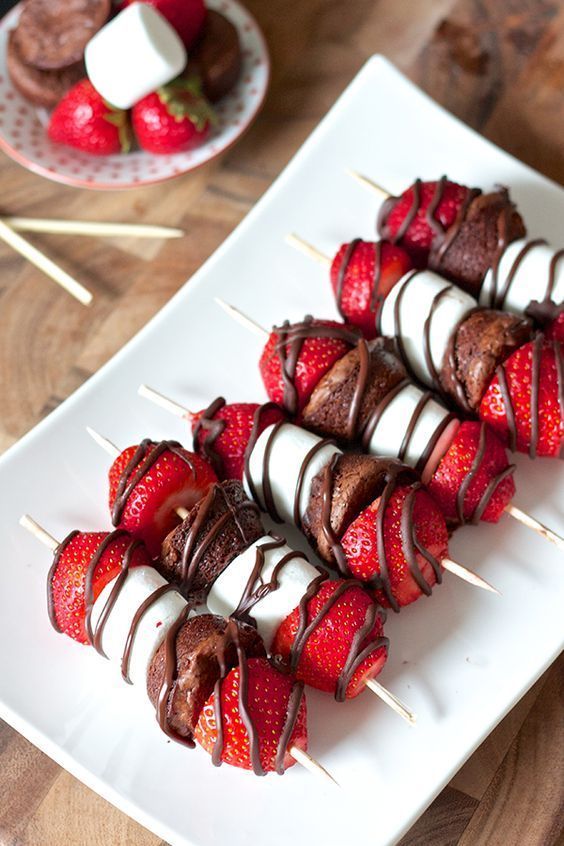 chocolate covered strawberries on skewers with toothpicks