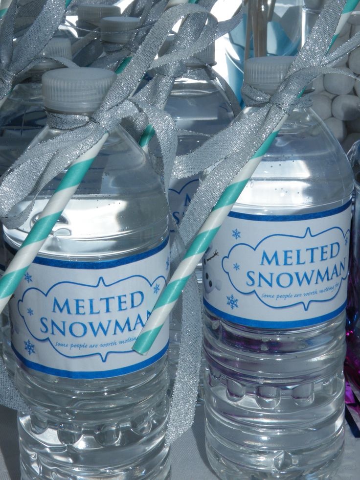 two bottled water bottles sitting next to each other with straws in front of them