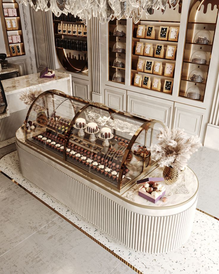 a display case in a store filled with lots of cakes and pastries on top of it