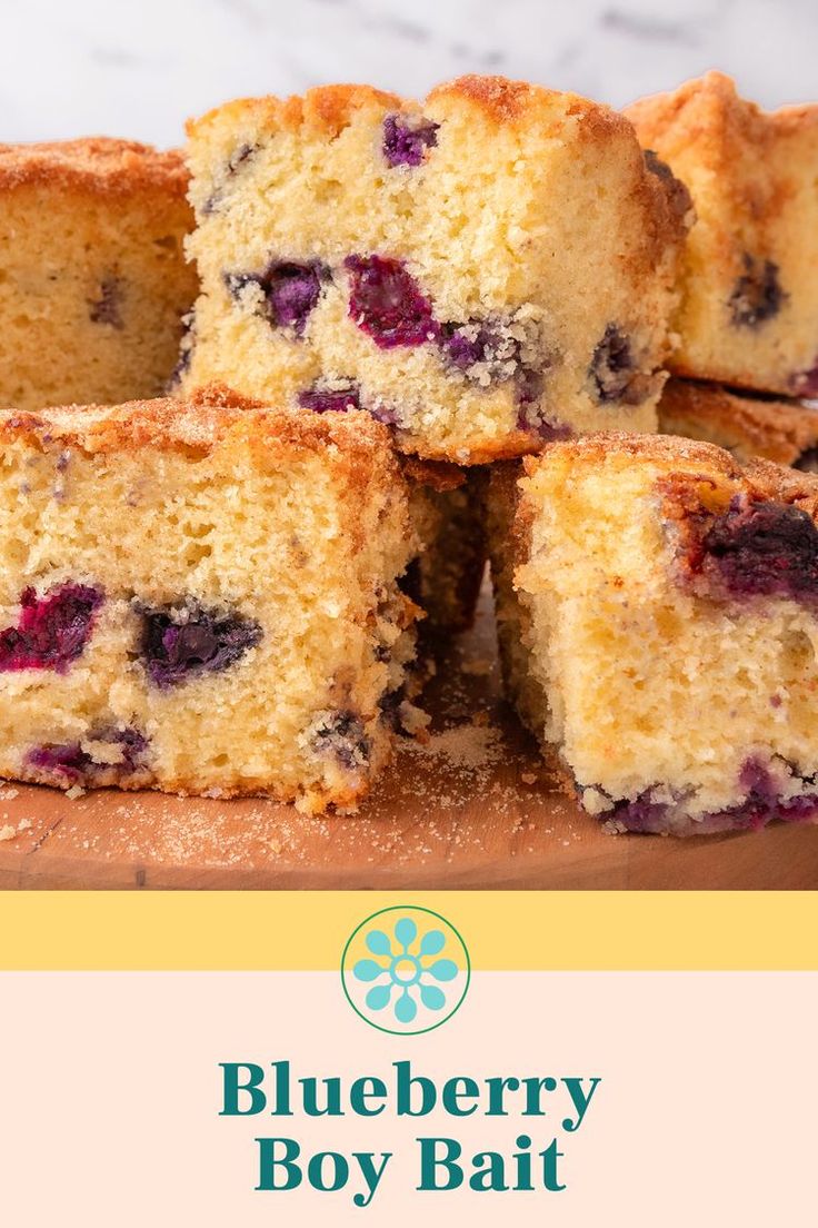 blueberry boy bake is cut into squares on a cutting board with the words blueberry boy bake below it